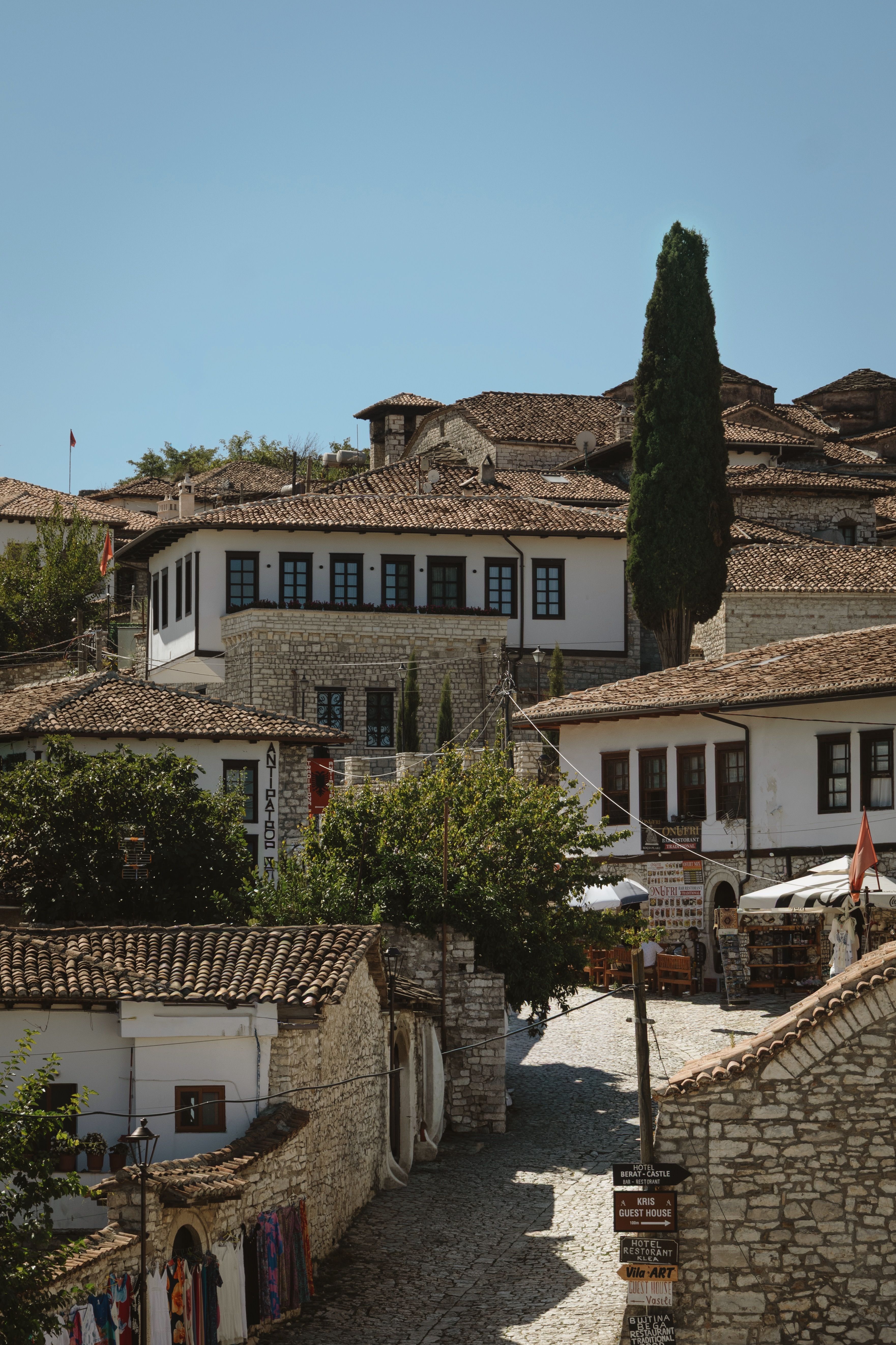 Scenic view of traditional stone houses and cobbled streets in UNESCO-listed Berat, Albania.