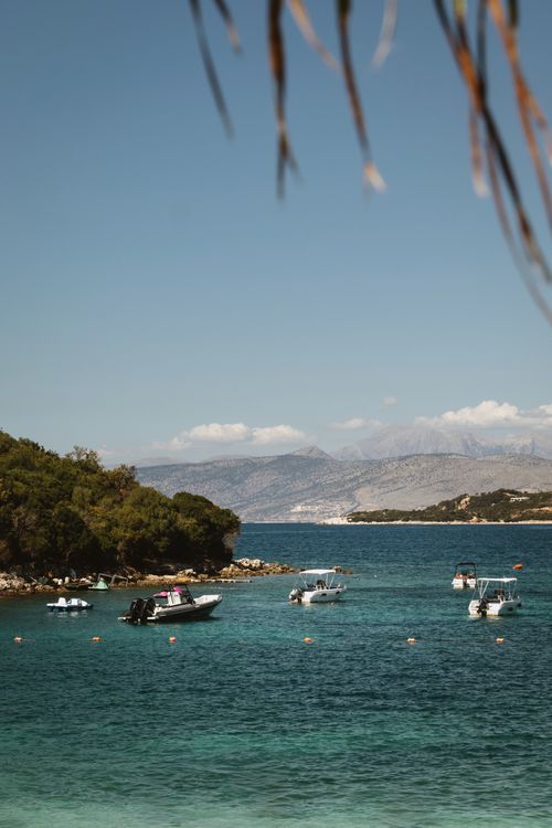 Free Explore the stunning turquoise waters and vibrant beaches of Ksamil, Albania. Stock Photo