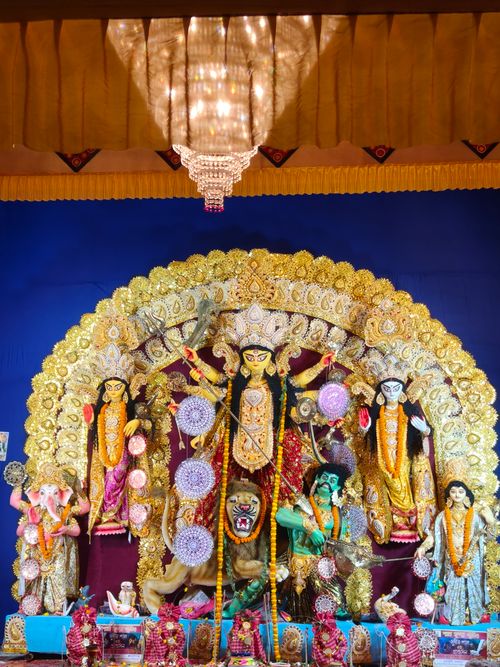 Free Colorful Durga Puja pandal decoration showcasing deities in Kolkata. Stock Photo