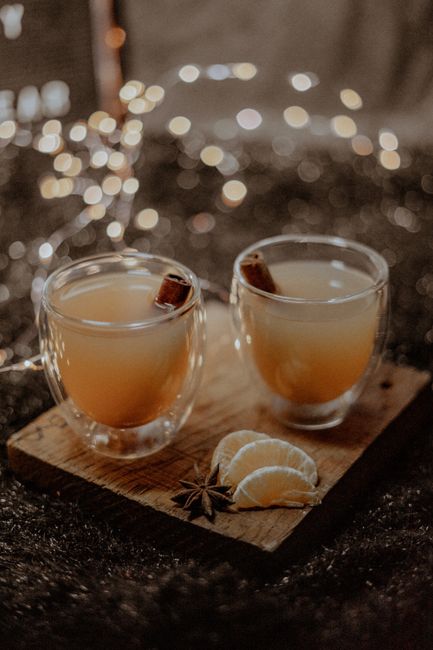Warm spiced tea with citrus slices and star anise, perfect for a cozy winter evening.