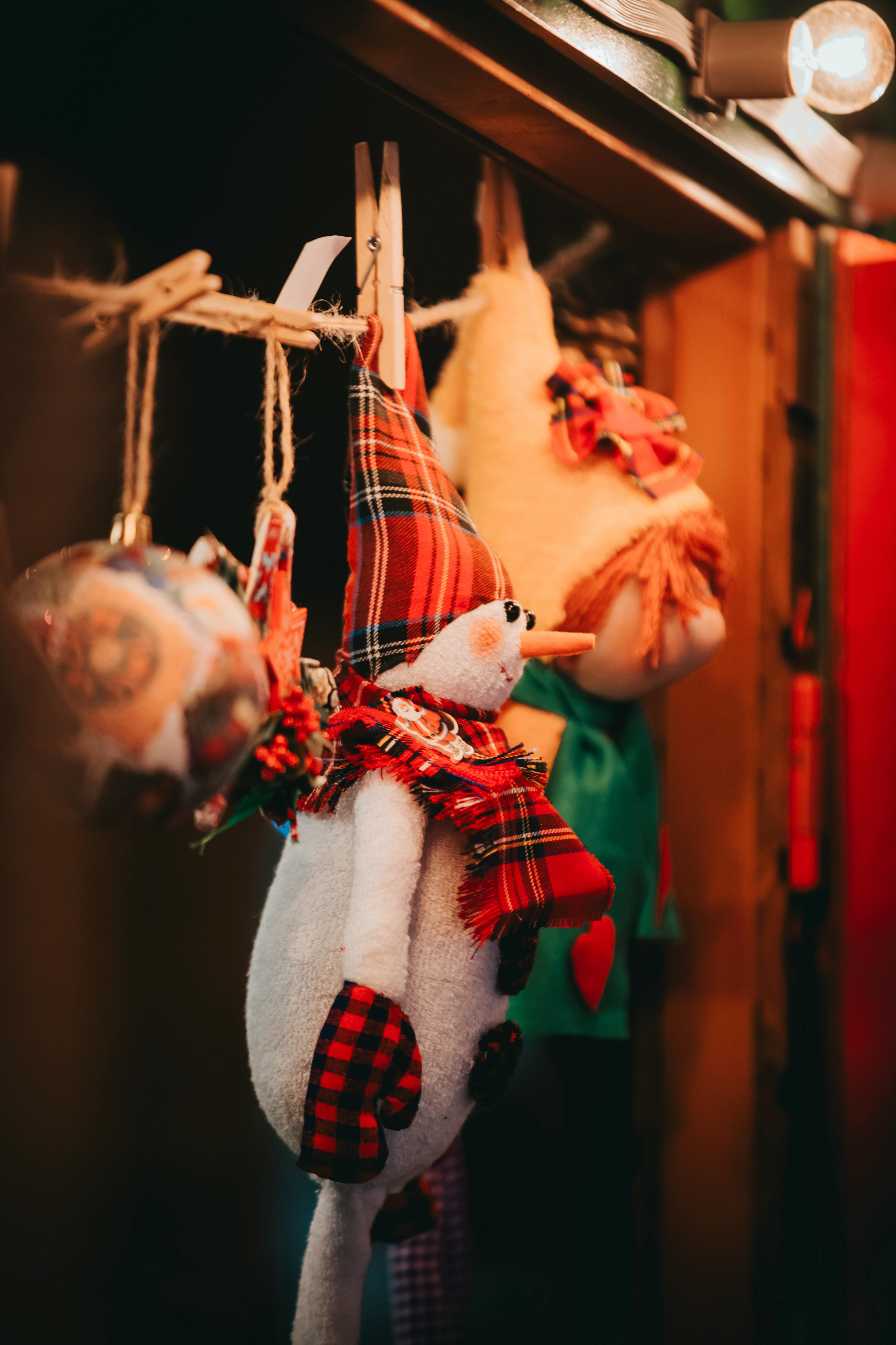 white and red snowman plush toy hanging