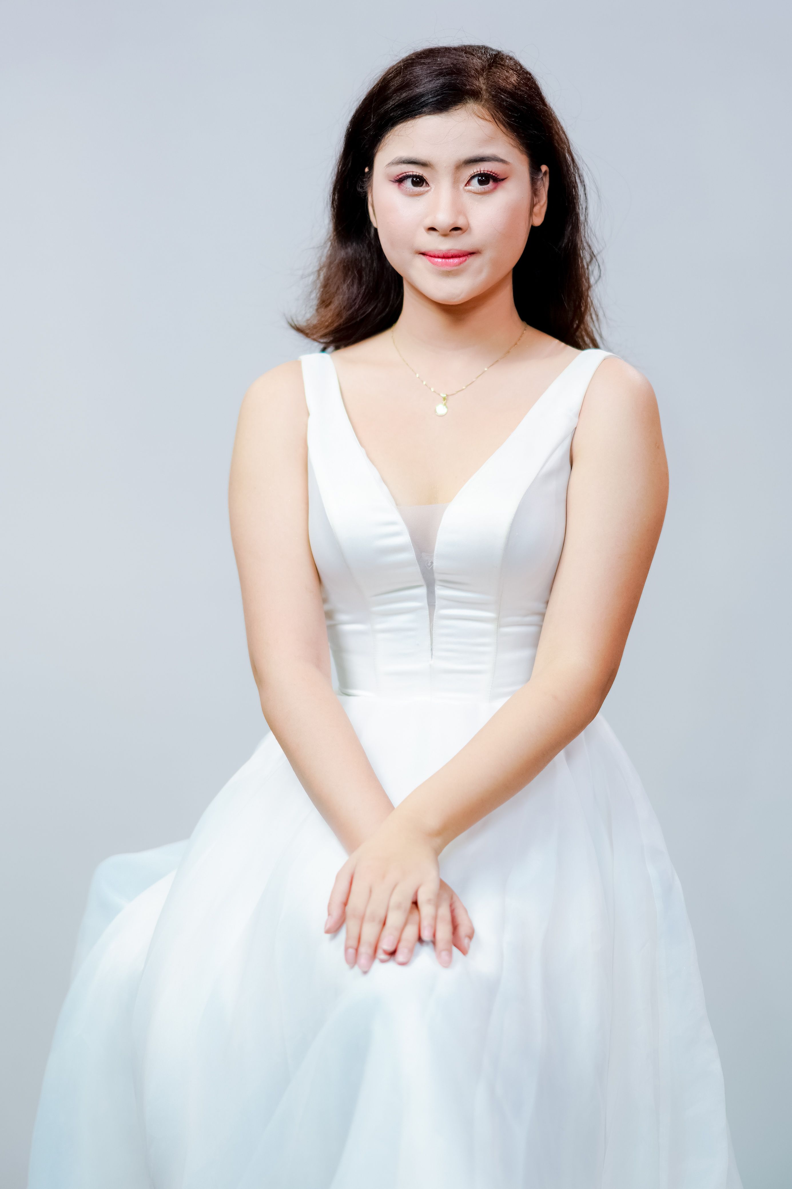 Elegant Portrait of Woman in White Dress · Free Stock Photo