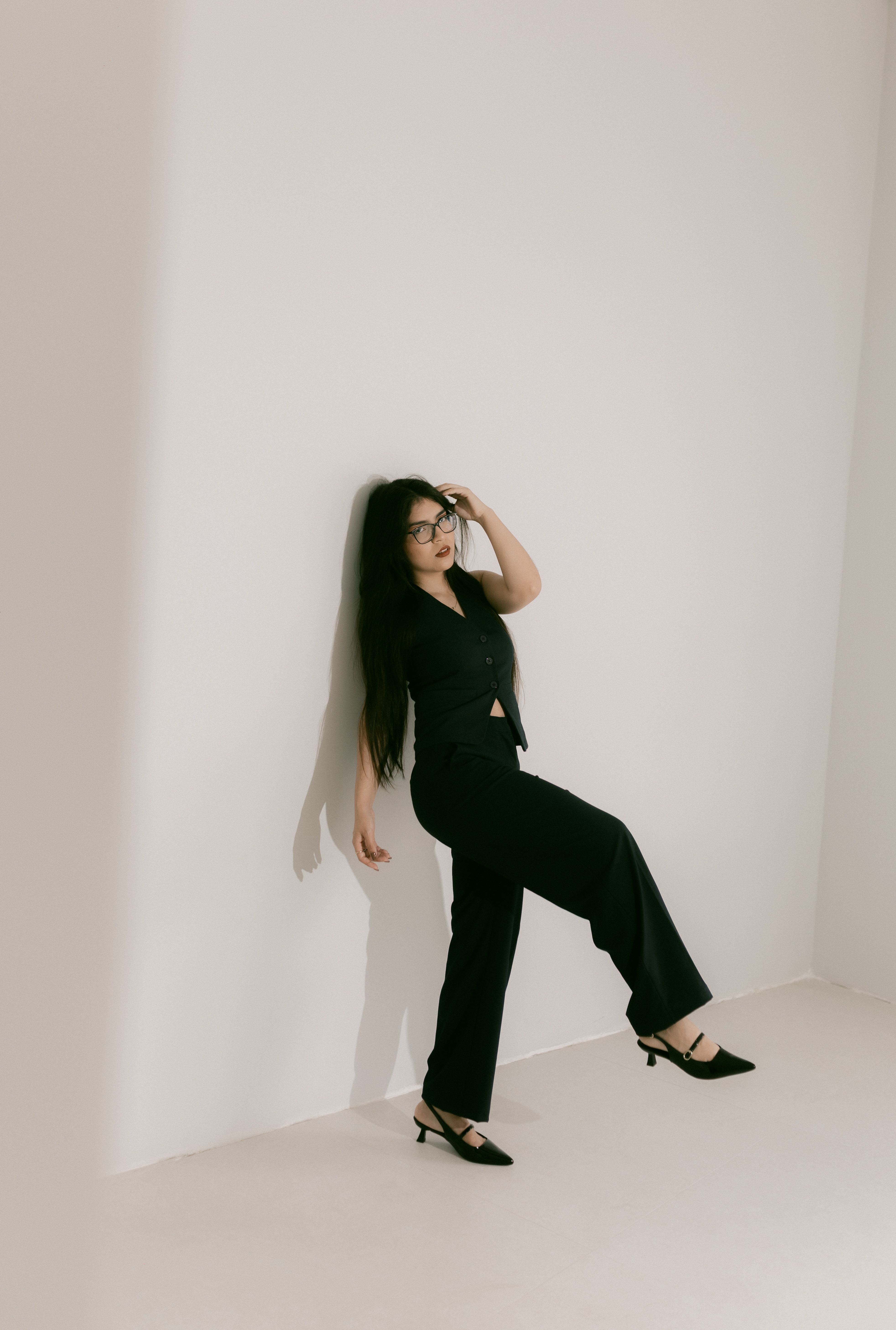 Stylish Woman Posing in Minimalist Setting · Free Stock Photo