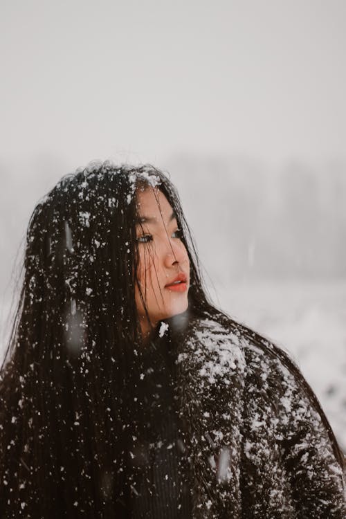 Woman With Snow on Her Clothes
