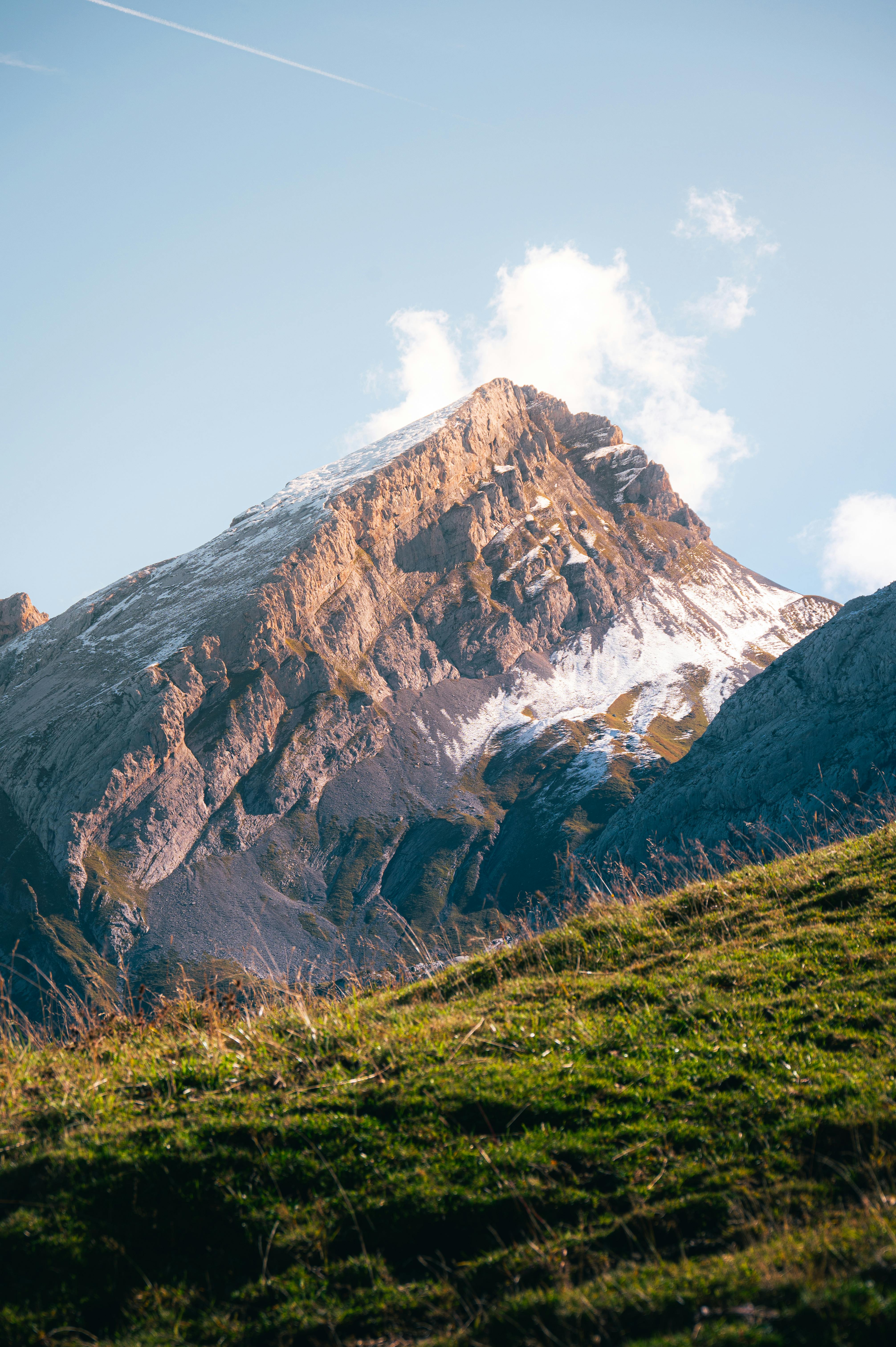 Breathtaking view of a snowy mountain peak in Le Grand-Bornand, France during fall.