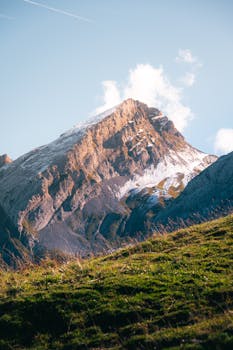 Breathtaking view of a snowy mountain peak in Le Grand-Bornand, France during fall.
