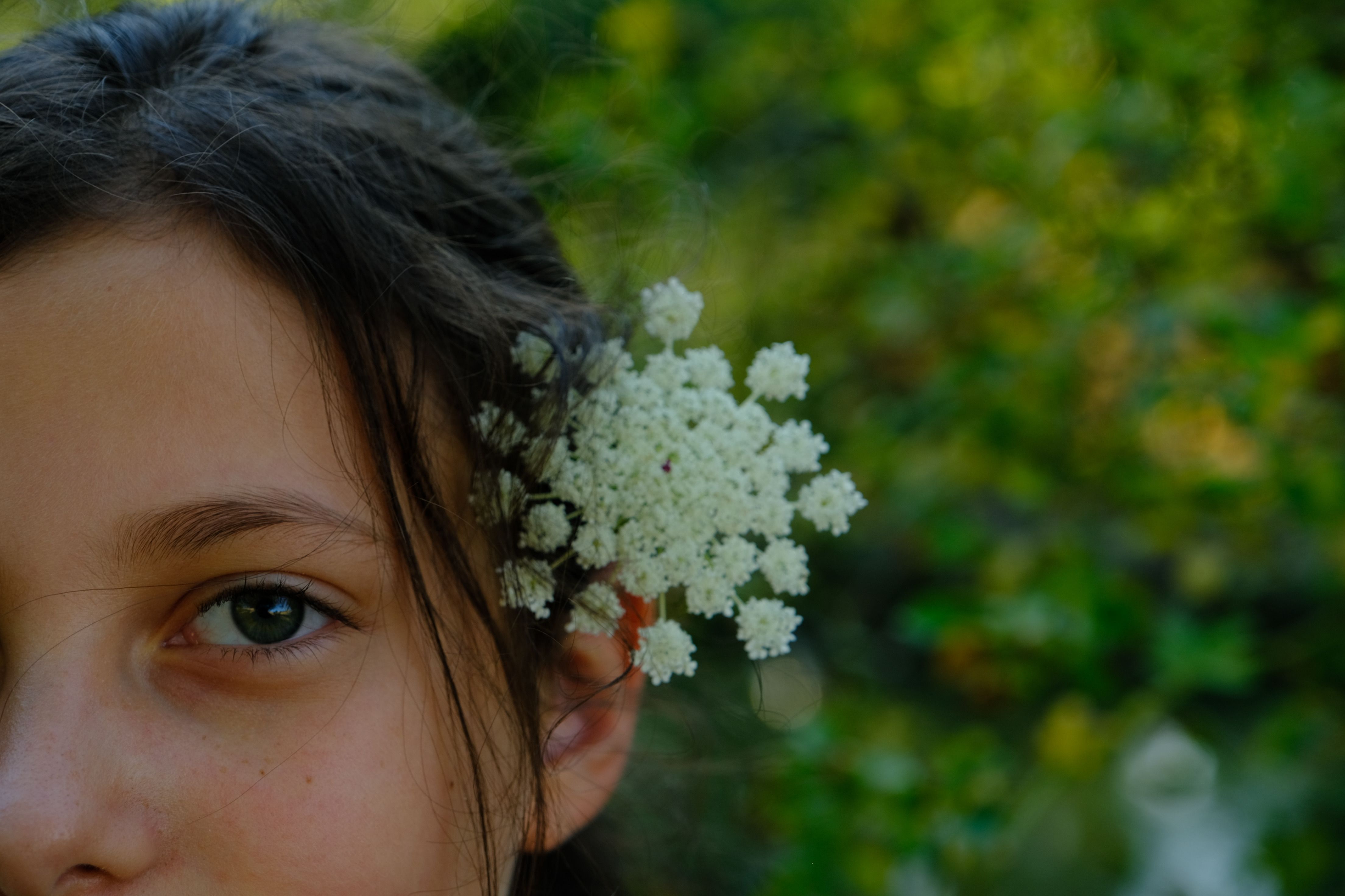 Young Girl with Flowers in Hair, Outdoor Portrait · Free Stock Photo