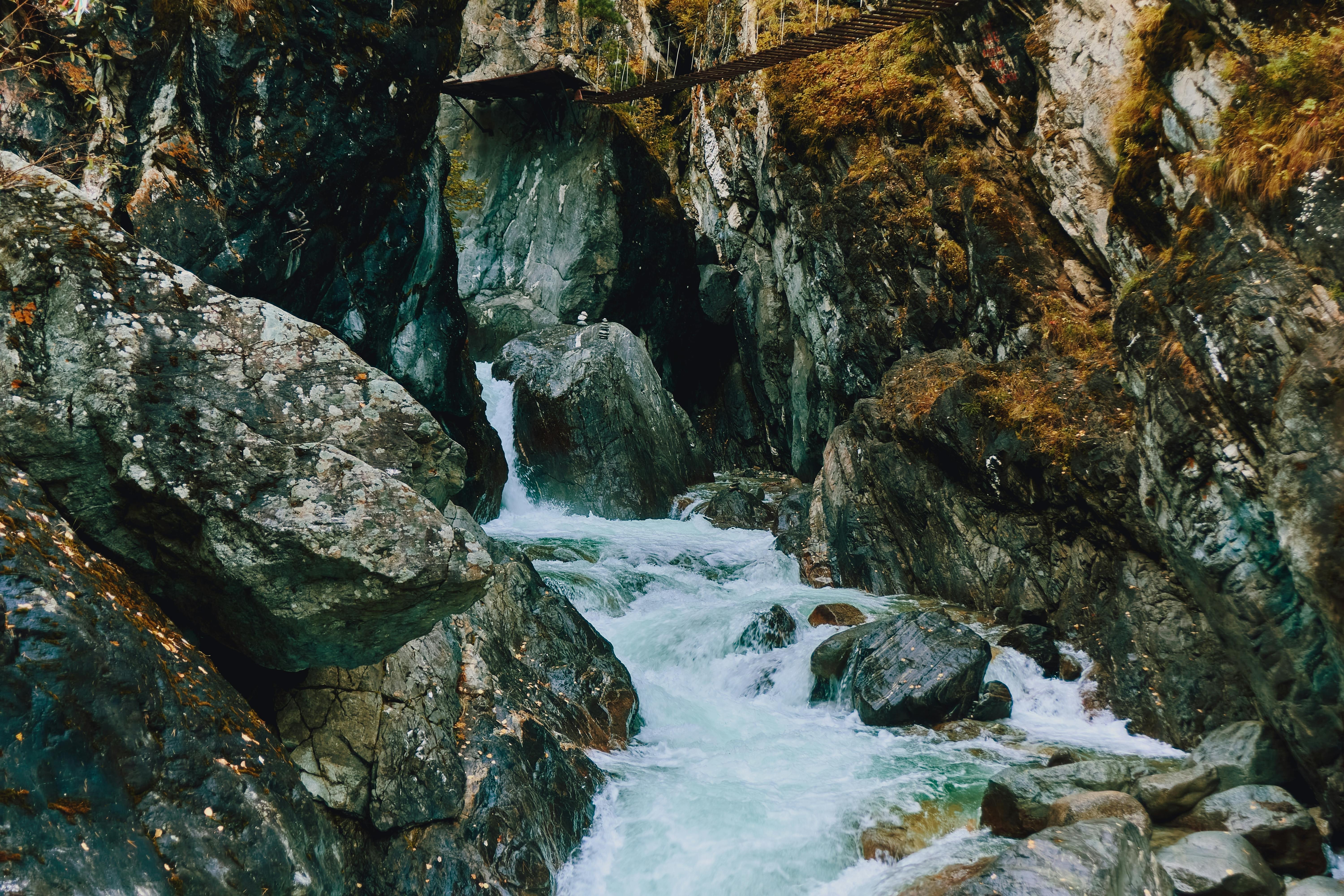 A picturesque mountain stream flowing through rocky terrain in Arshan, Buryatia, Russia.