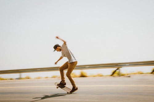 Free Man Doing Tricks on the Skateboard Stock Photo