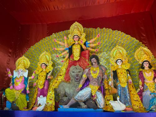 Free Intricately decorated statues showcasing Hindu deities during Durga Puja festival. Stock Photo
