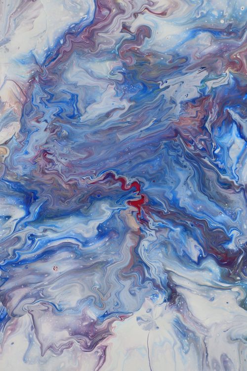 Free Dynamic abstract marble texture in vivid blue and purple tones with red accents. Stock Photo