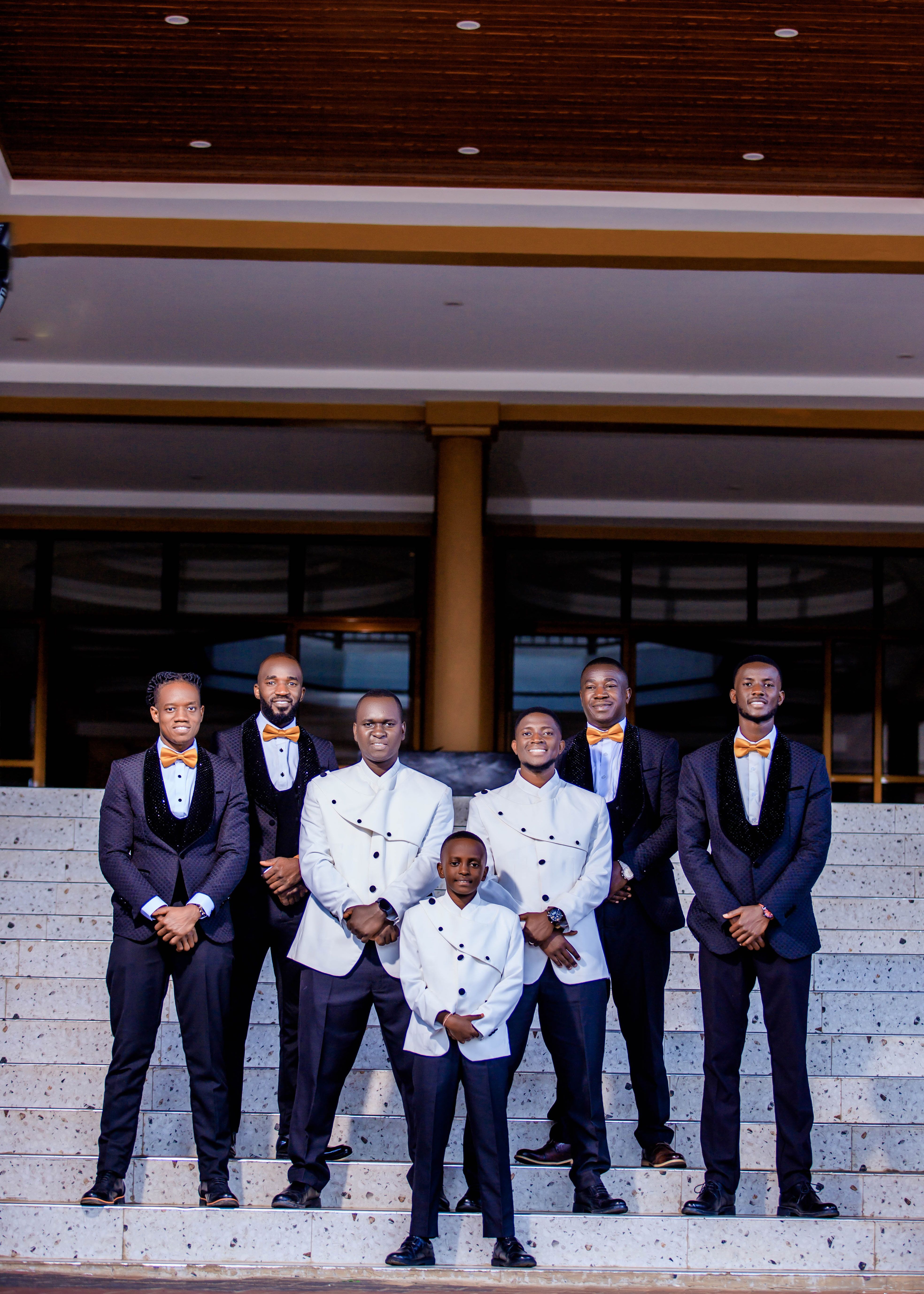Elegant Group of Men in Formal Suits Posing  Free Stock Photo