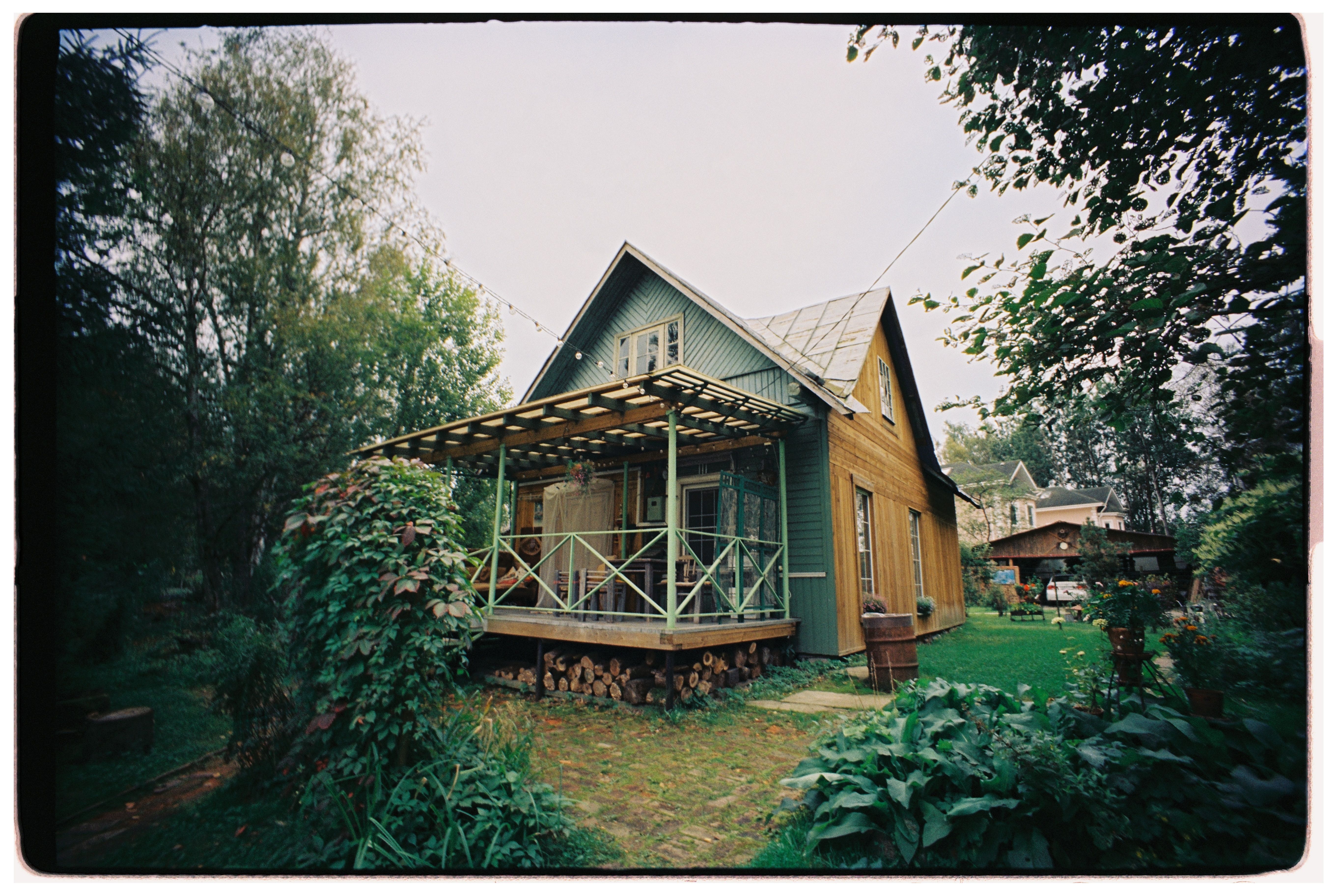 Charming Rustic Cabin with Lush Garden · Free Stock Photo