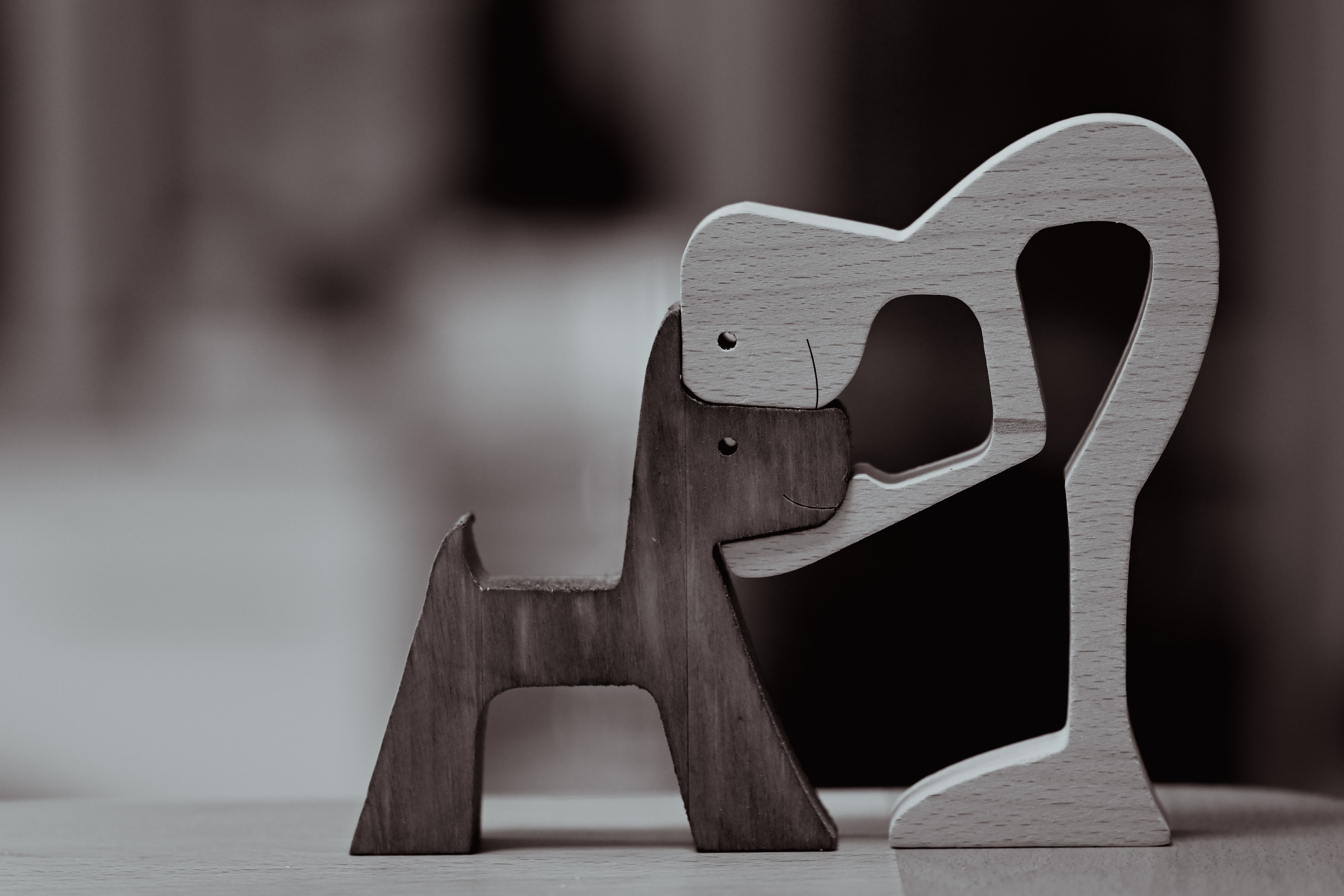 custom a white lion figurine sitting on top of a wooden table for pet memorial display