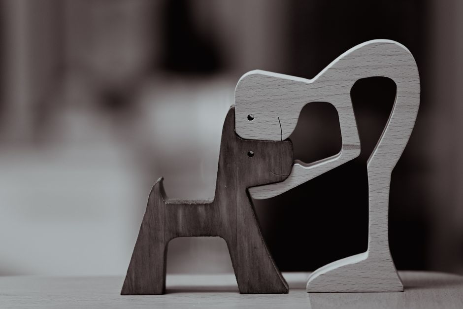 custom a white lion figurine sitting on top of a wooden table for pet memorial display