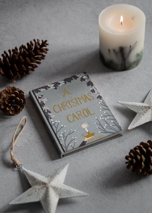 Free Photo Of Book Near Candle Stock Photo