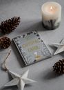 Photo Of Book Near Candle