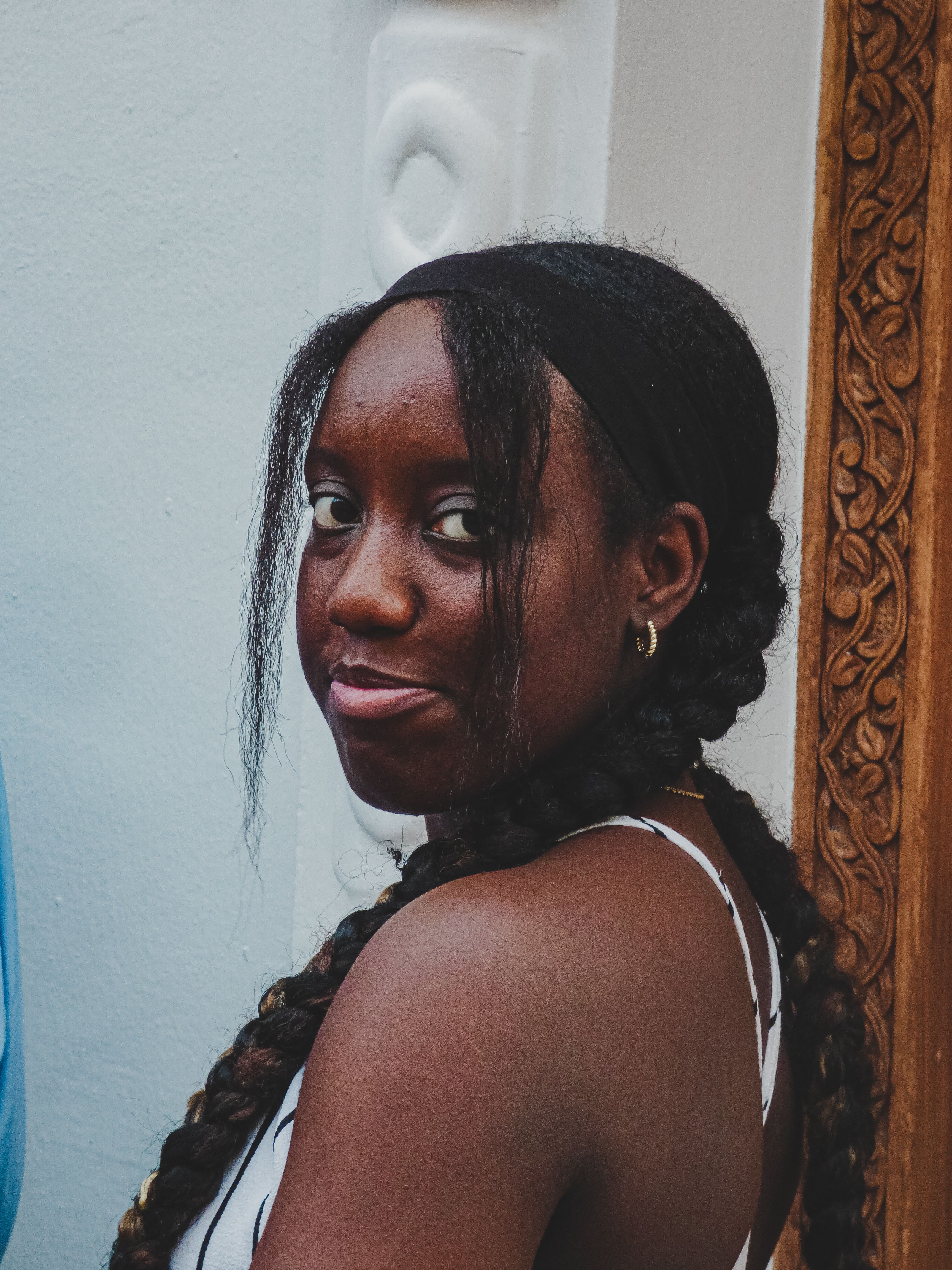 Portrait of a Young Woman with Braided Hair · Free Stock Photo