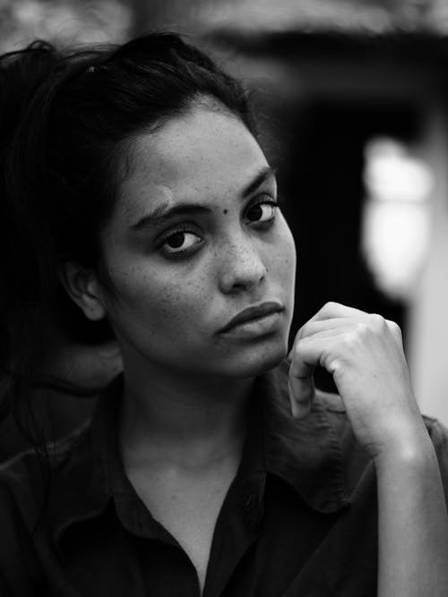 Greyscale Photo of Woman Wearing Coat