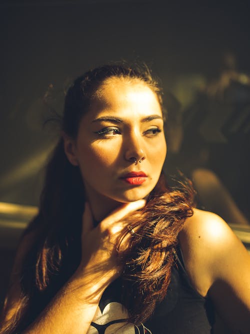 Woman Wearing Halter Dress Inside Well-lit Room