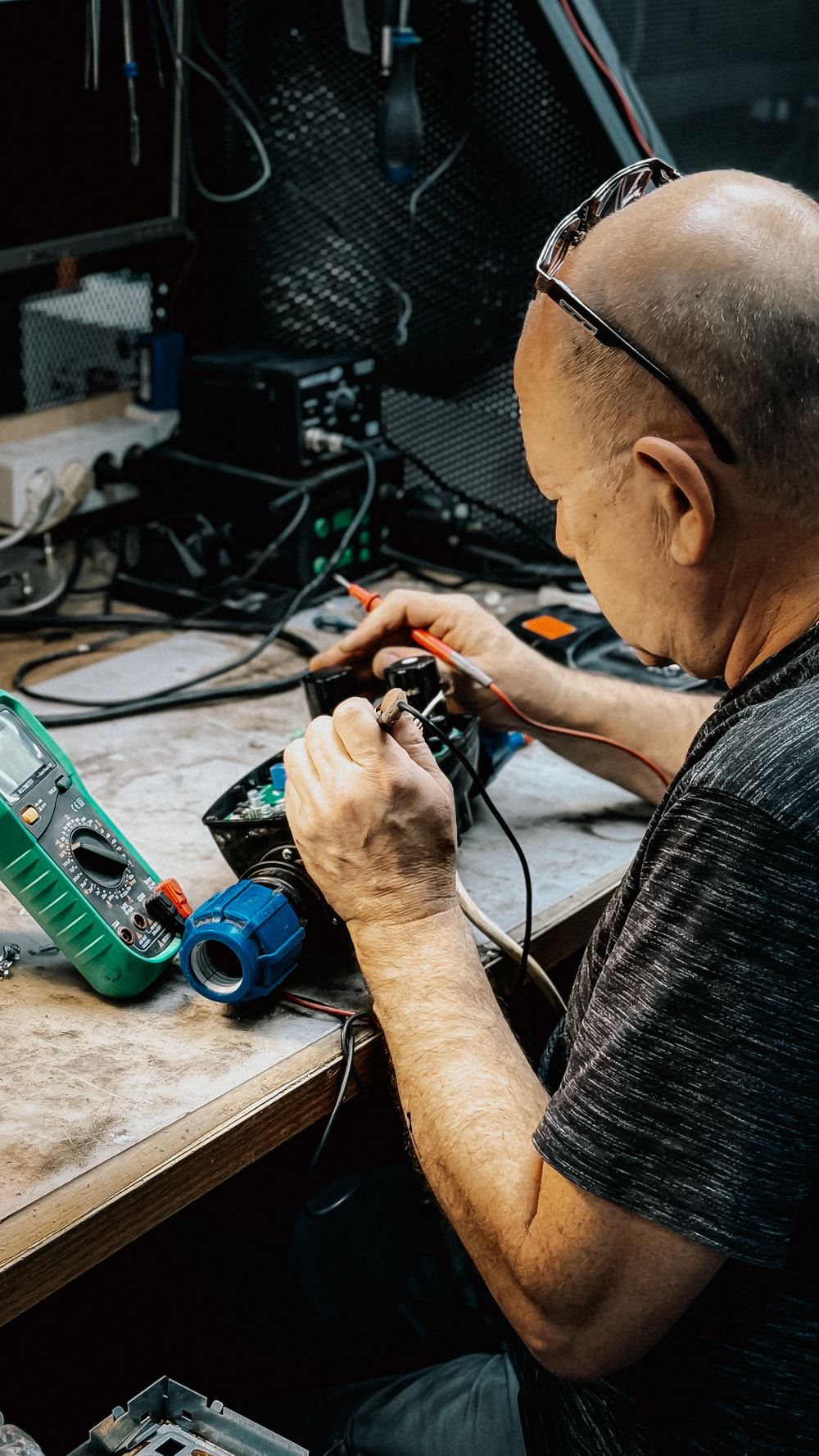 Senior technician at Samriddhi Electronics and Automation inspecting a control card