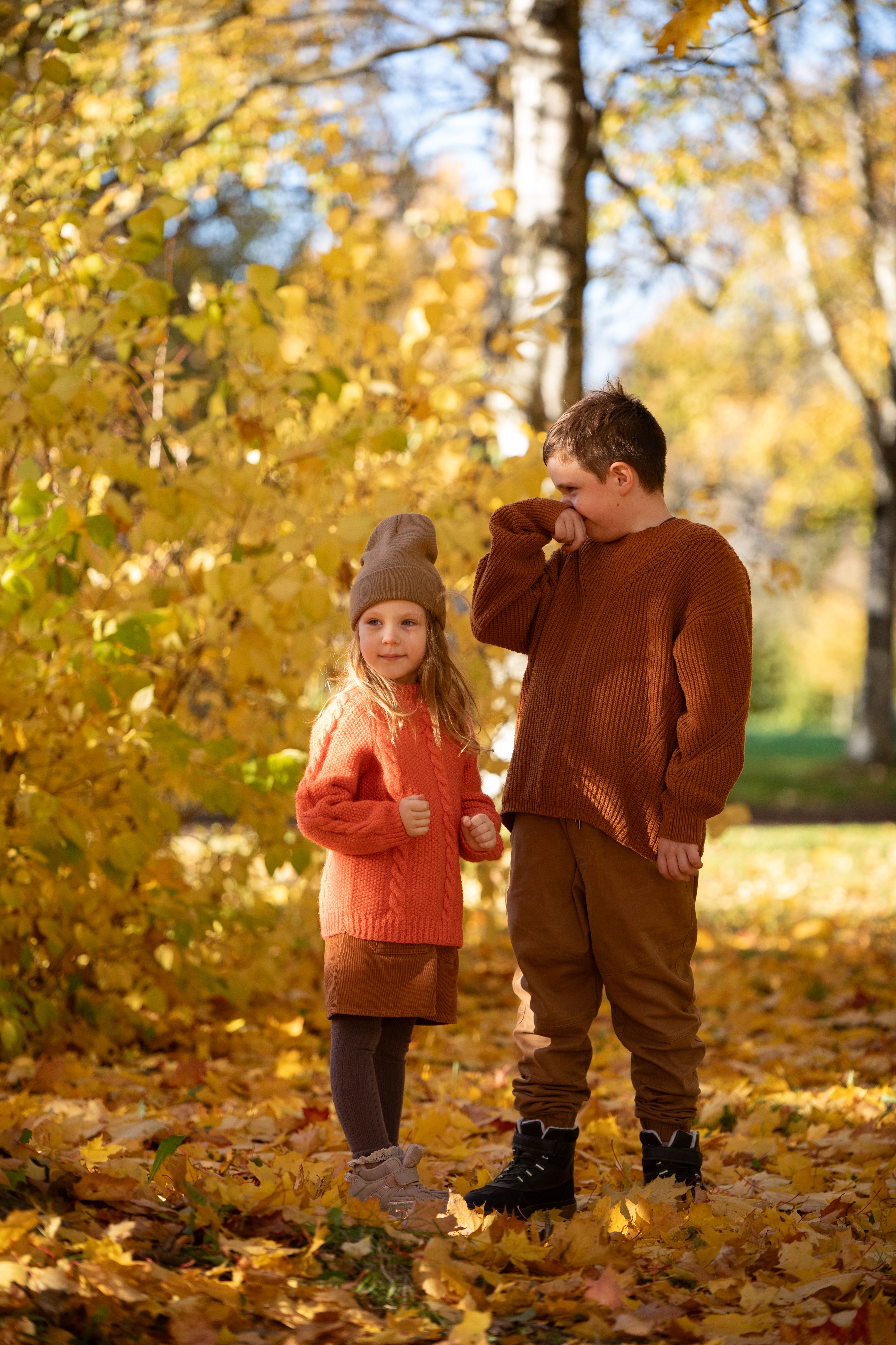 Children Playing in Autumn Leaves Outdoors · Free Stock Photo