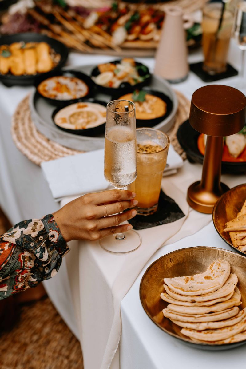 Luxurious dining table with exotic dishes and elegant tableware, showcasing a rich culinary experience.
