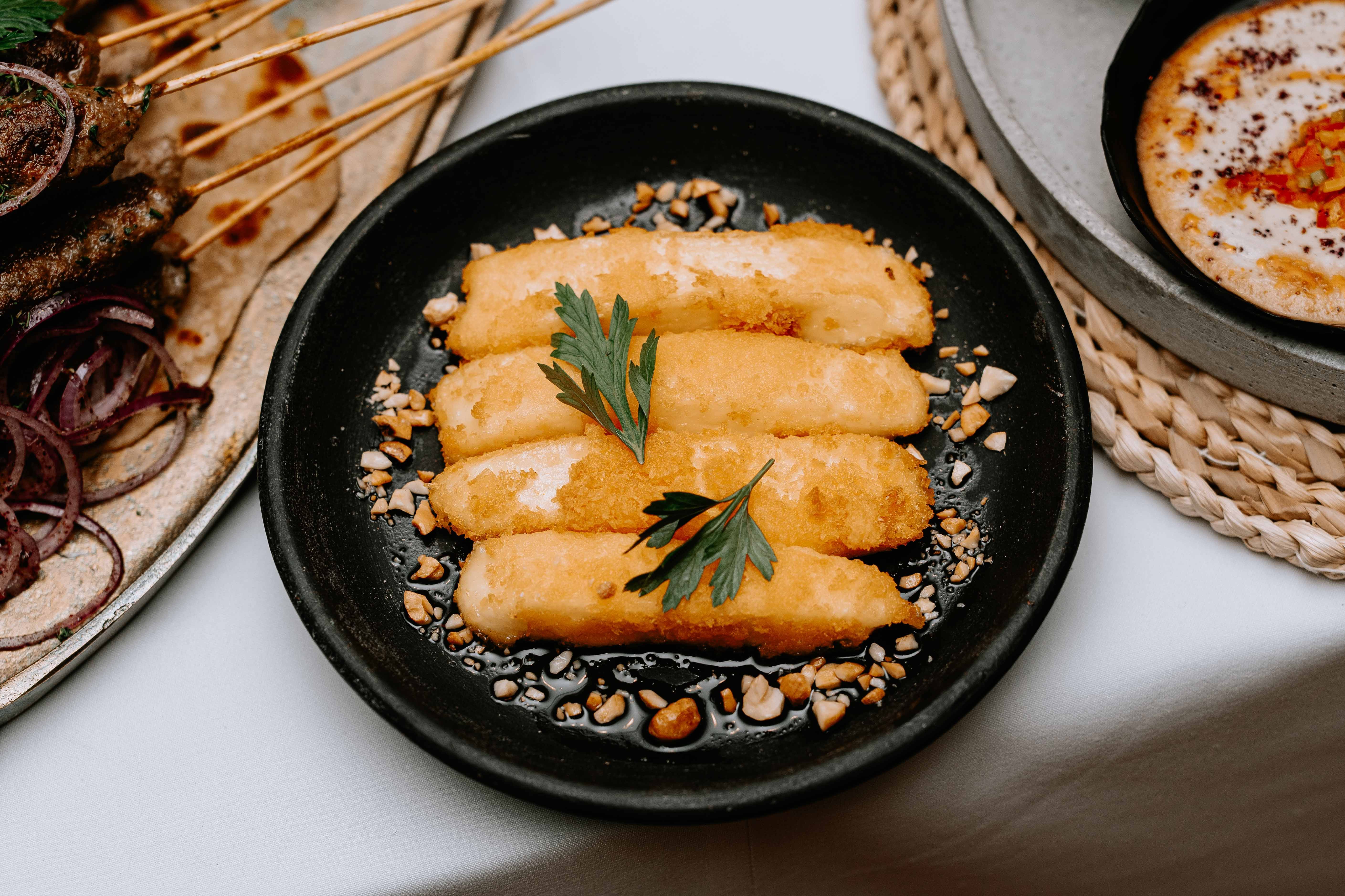Delicious Plated Arabic Cuisine with Skewers · Free Stock Photo