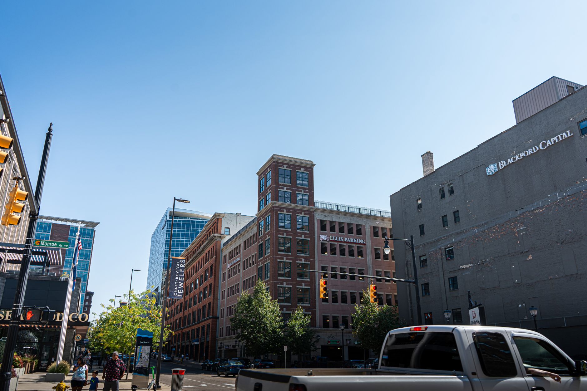 Vibrant urban street view of downtown Grand Rapids, showcasing city life and architecture.