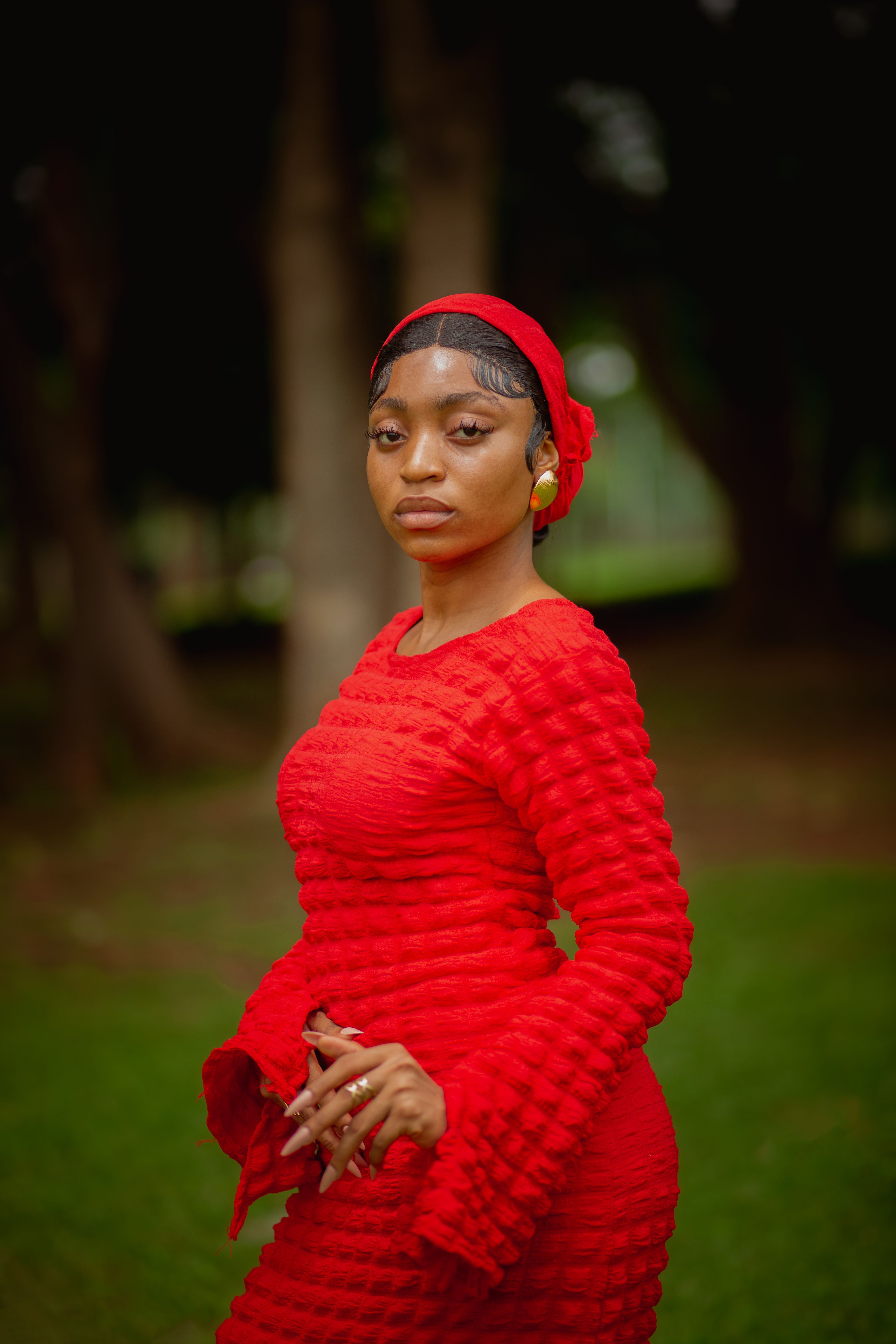 Elegant Woman in Red Dress Outdoors in Abuja · Free Stock Photo