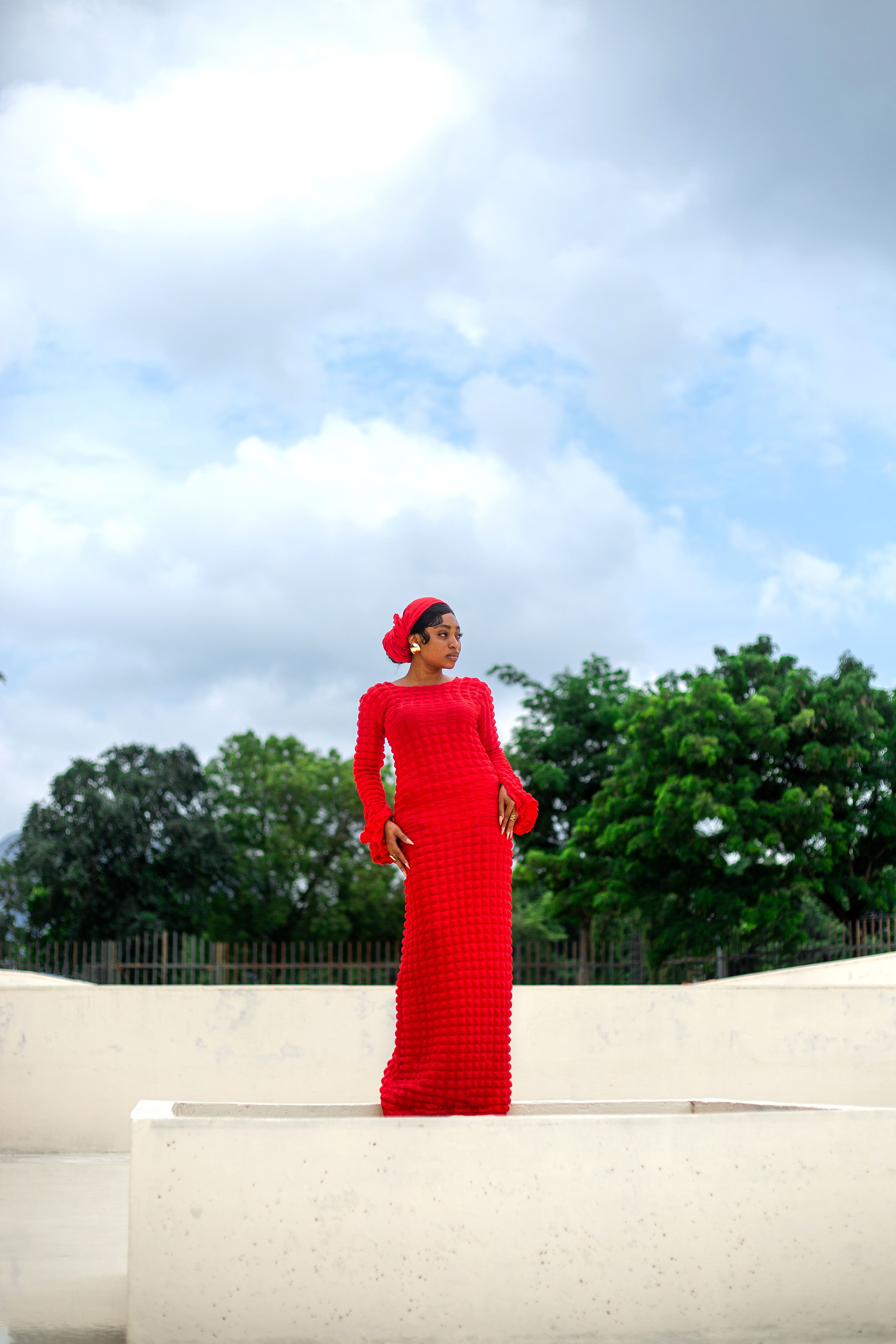 Elegant Portrait of Woman in Red Dress Outdoors · Free Stock Photo