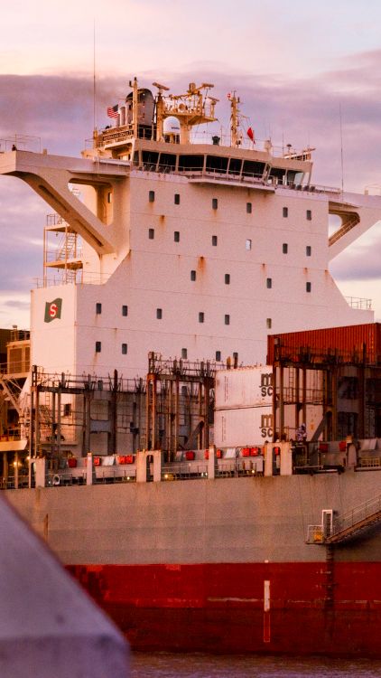 Global shipping port at sunset representing international trade and quality infrastructure