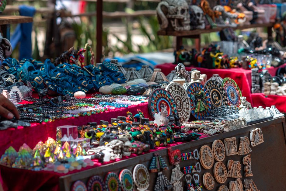 Vibrant display of handcrafted Mexican souvenirs at Chichén Itzá market, Yucatán.