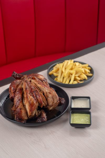 Plate of roasted chicken with sides — photo by Arti.tic on Pexels