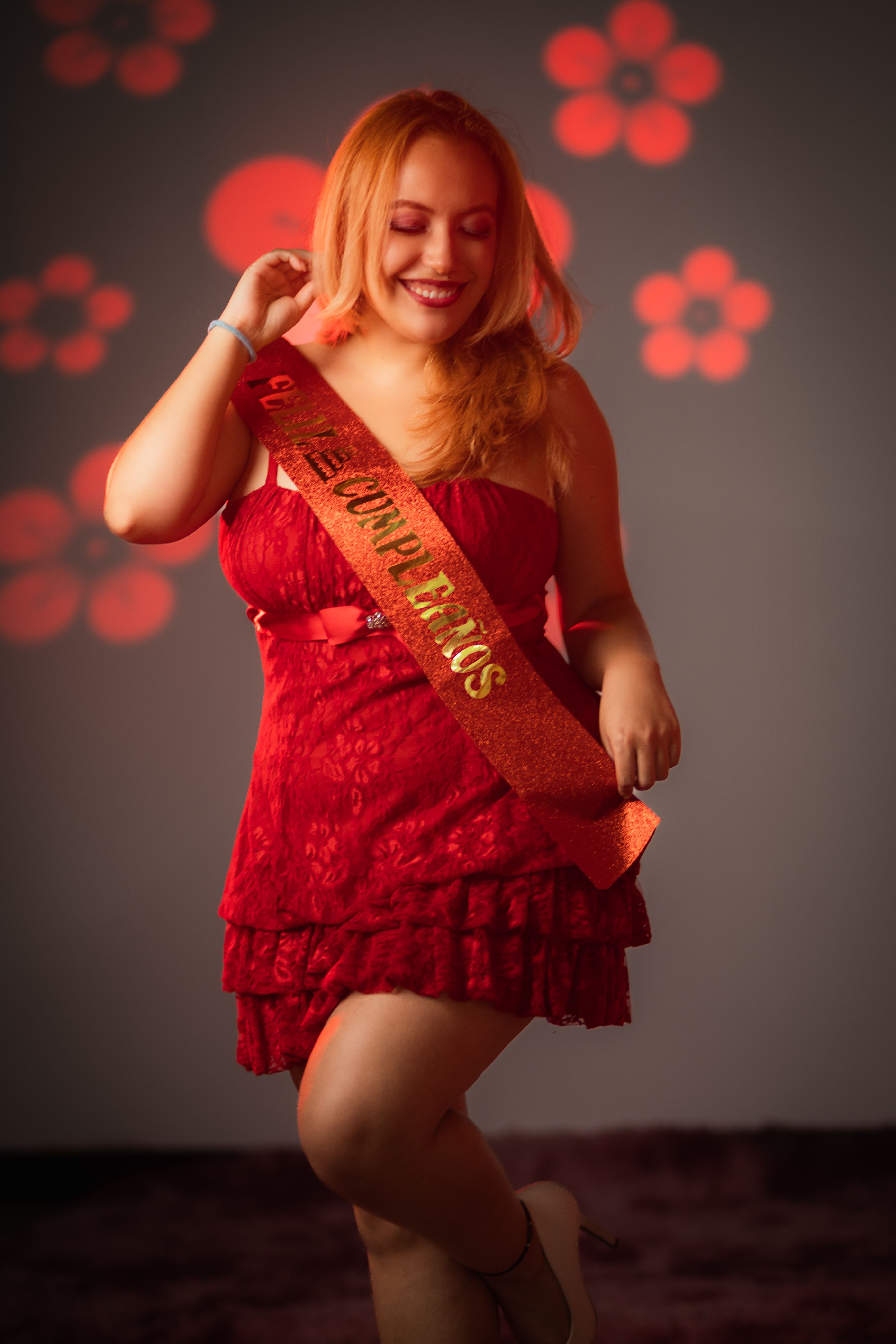 Birthday Celebration with Smiling Woman in Red Dress · Free Stock Photo
