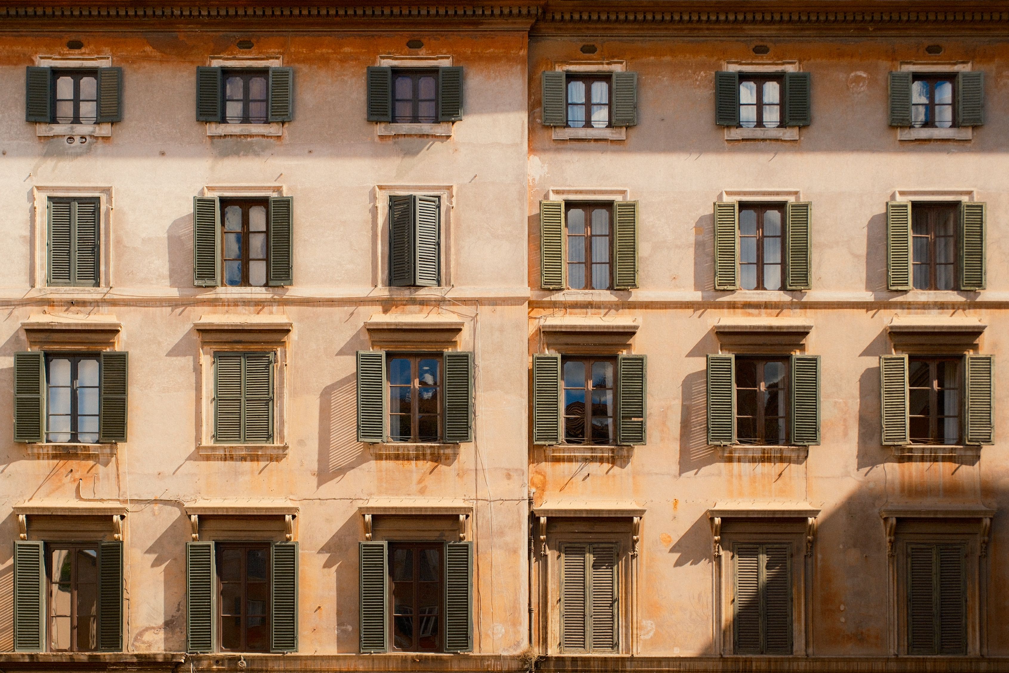 Historical Building Facade with Symmetrical Windows · Free Stock Photo