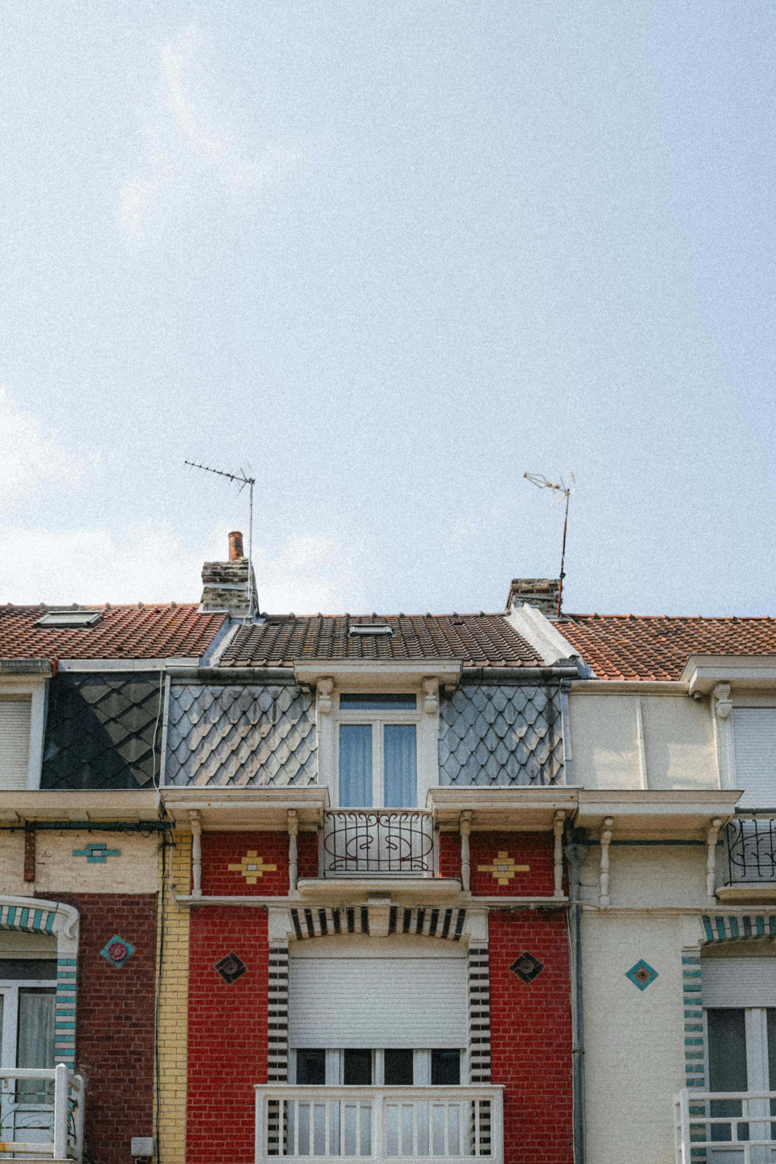 Charming row of colorful houses highlighting unique architecture in Dunkerque, France.