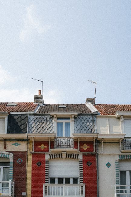 Charming row of colorful houses highlighting unique architecture in Dunkerque, France.