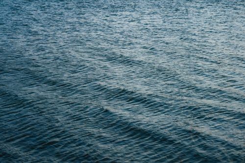 Free Gentle ocean waves create a serene view at Dunkerque beach in France's Hauts-de-France region. Stock Photo