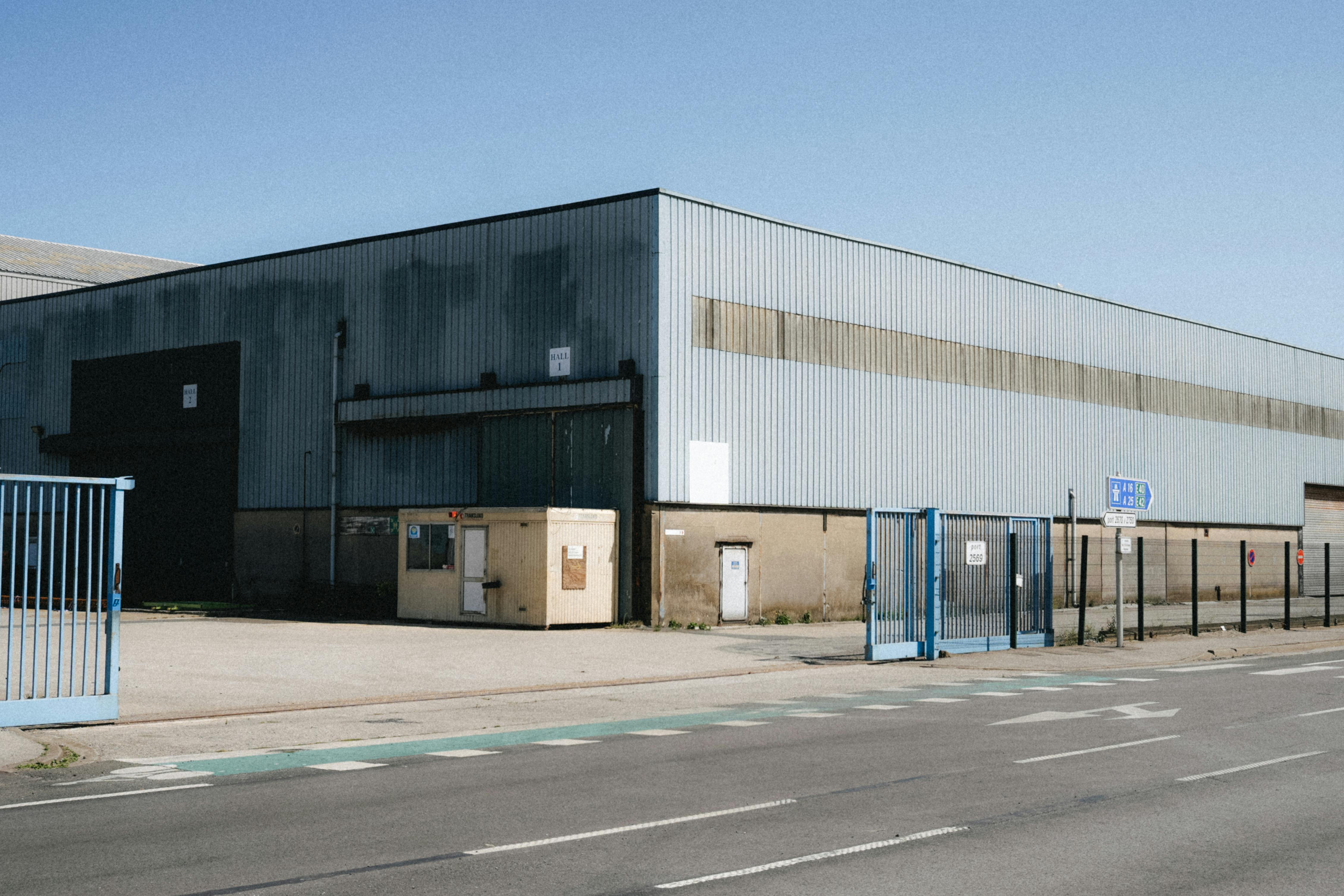 Industrial Warehouse Exterior in Dunkerque, France · Free Stock Photo, image size:1125x750