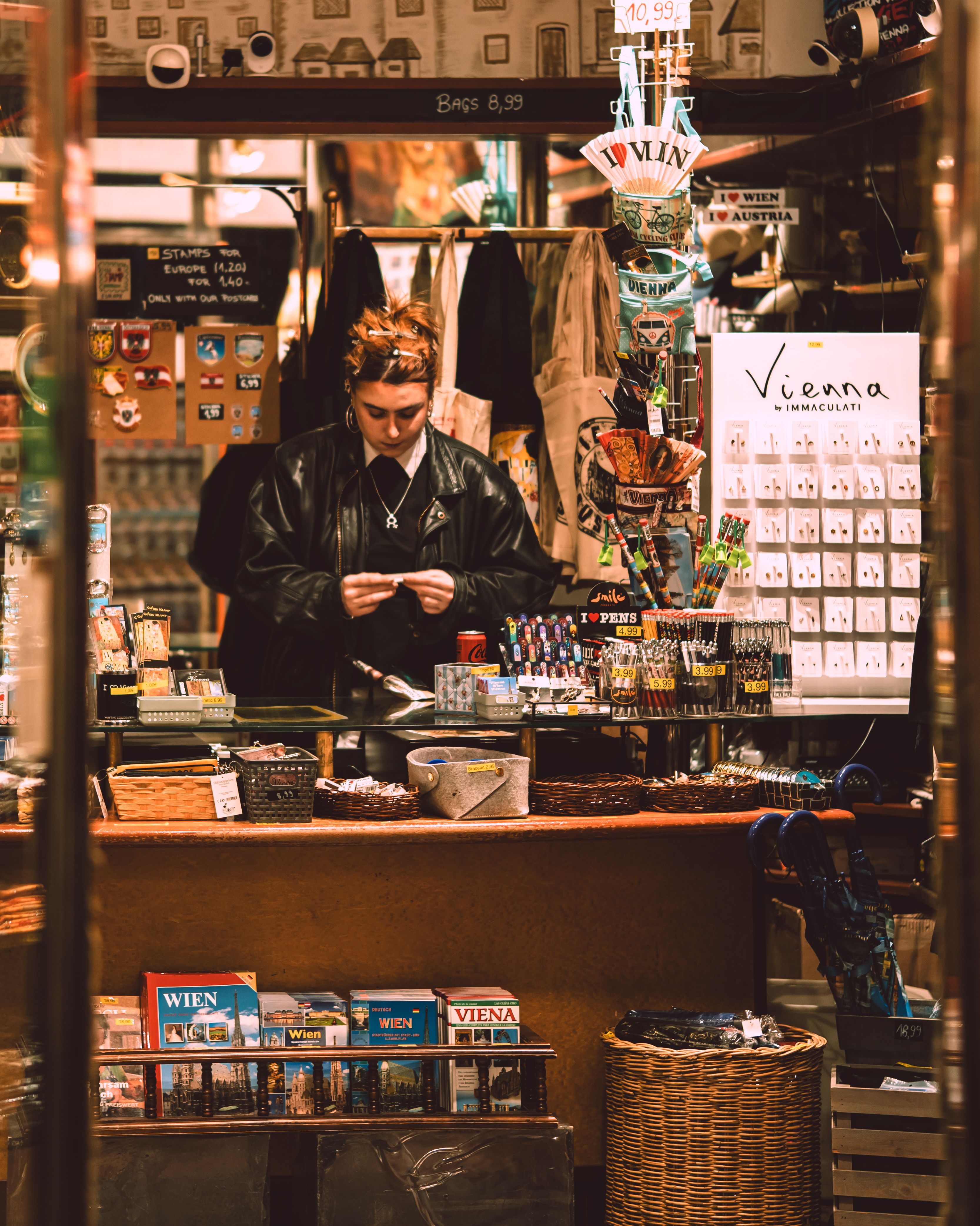 A cozy vintage shop in Vienna with a customer browsing souvenirs.