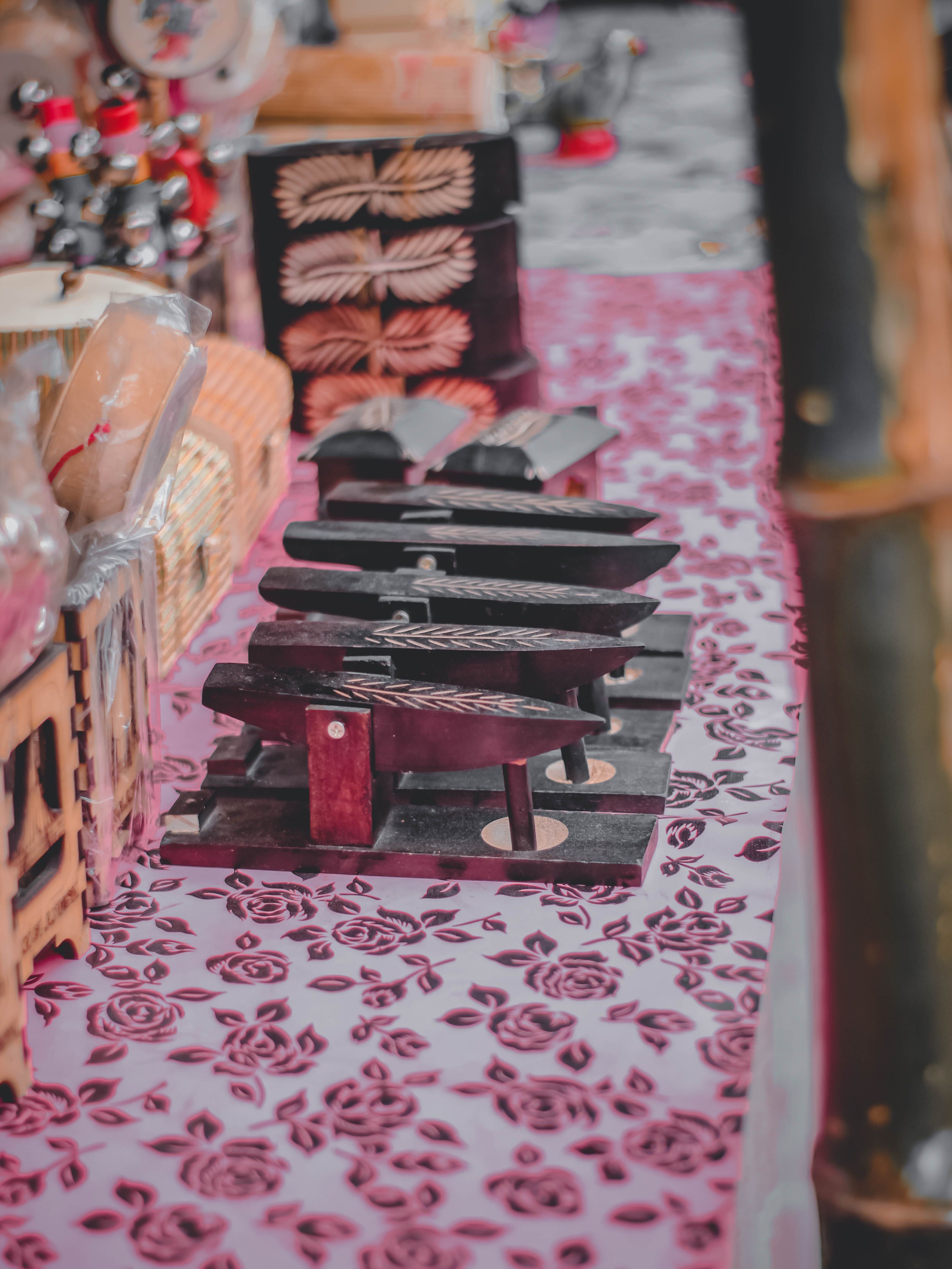Artistic wooden blocks for textile printing in a Rangpur market stall, showcasing traditional craftsmanship.