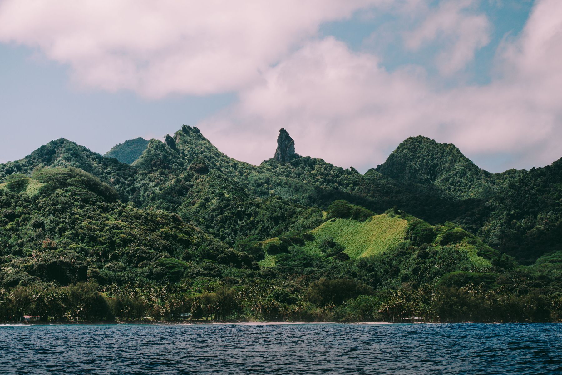 Lush mountains and ocean in the Cook Islands