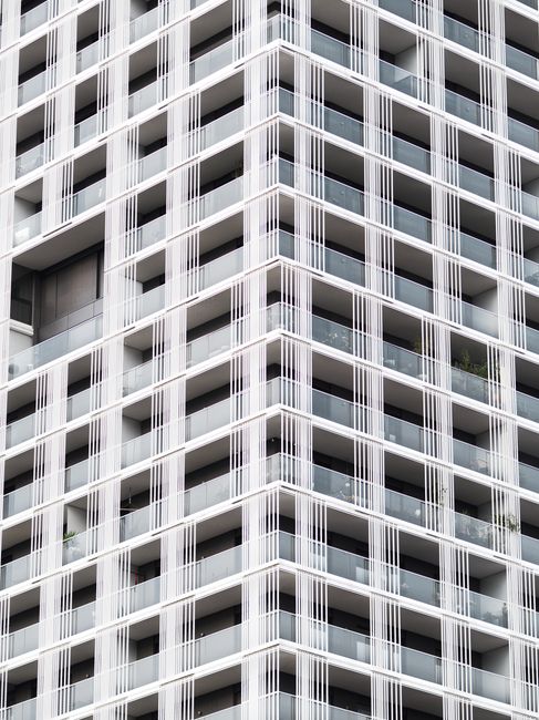 Close-up of a modern high-rise building facade with geometric patterns in Linz, Austria.