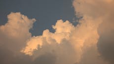 Dramatic Evening Clouds Against Blue Sky