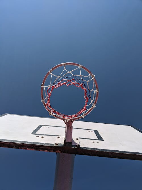 White Basketball Hoop Under Blue Sky