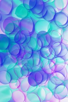 Bright and vibrant abstract bubbles in pastel colors create a dreamlike visual effect.