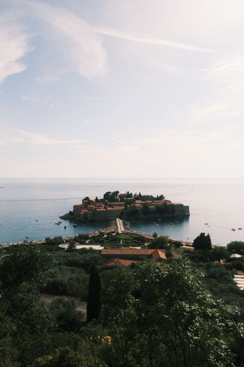 Free Scenic view of Sveti Stefan, a charming historic island off Montenegro's coast, surrounded by the Adriatic Sea. Stock Photo