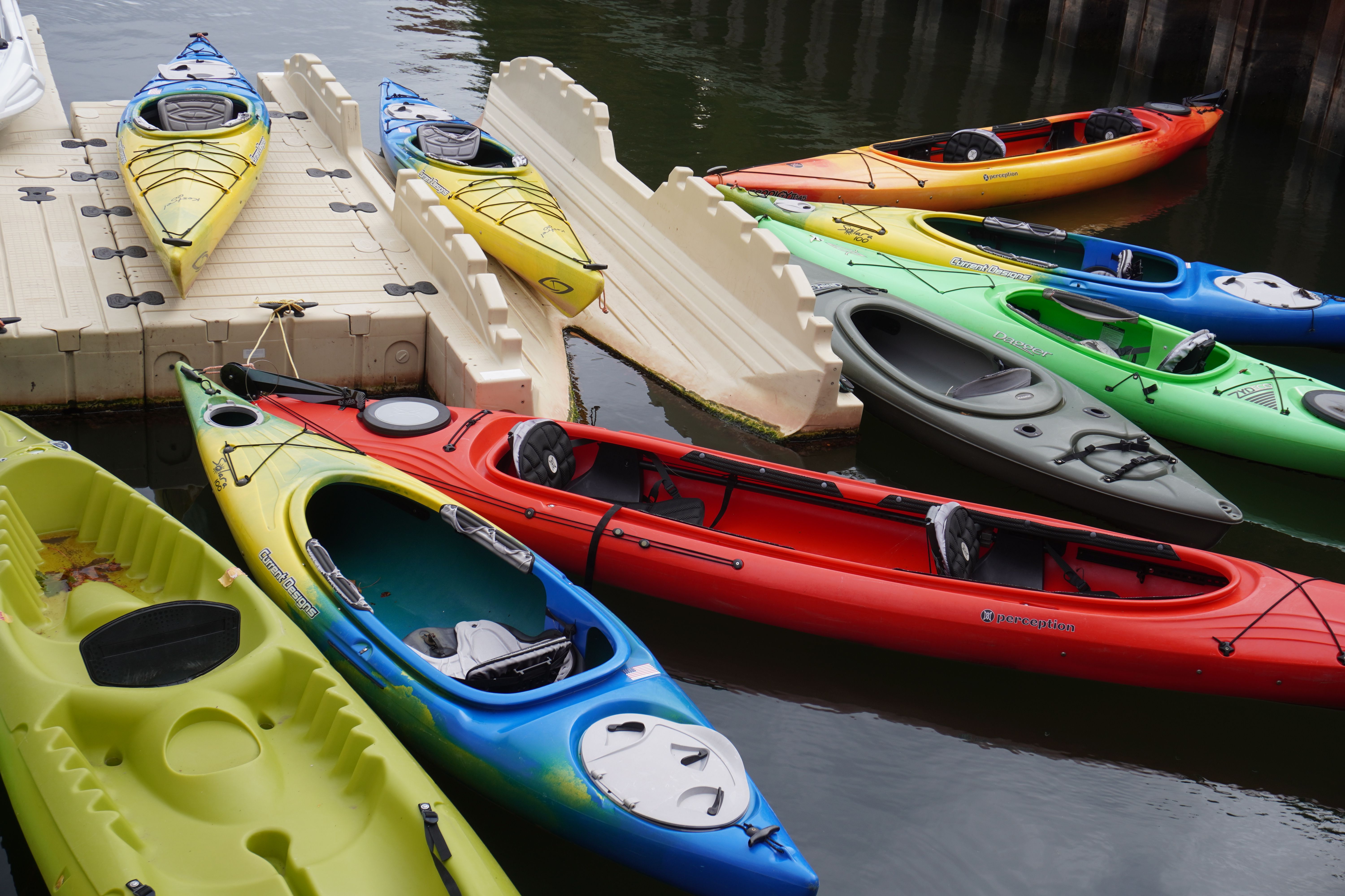 Colorful Kayaks Docked at a Waterfront · Free Stock Photo
