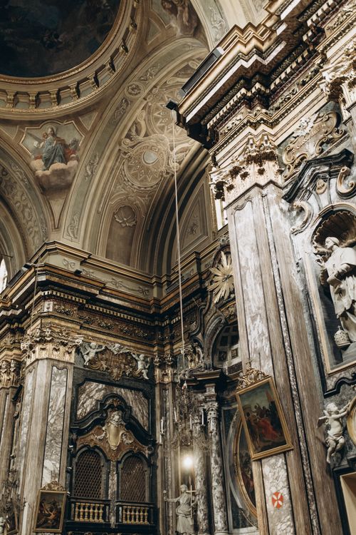 Free Exquisite Baroque church interior showcasing ornate architecture and religious artworks. Stock Photo
